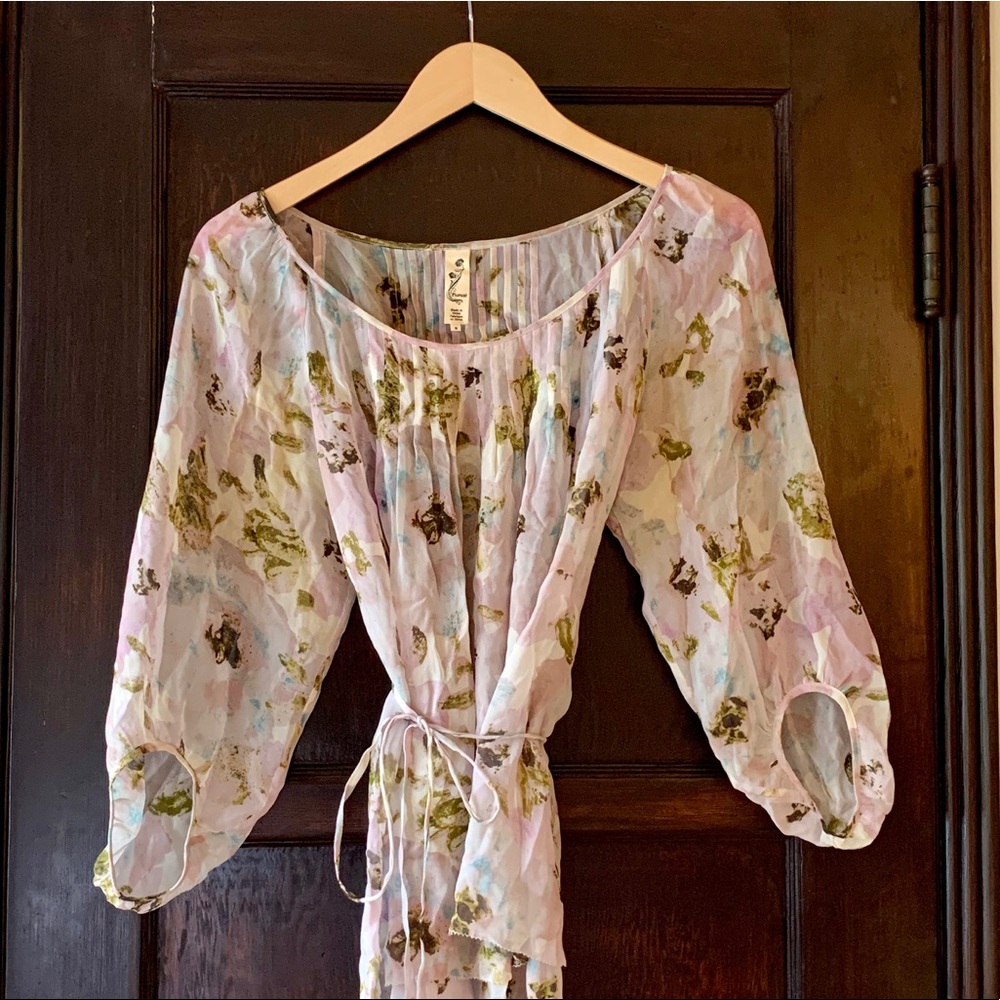 Sheer floral blouse with ties.
